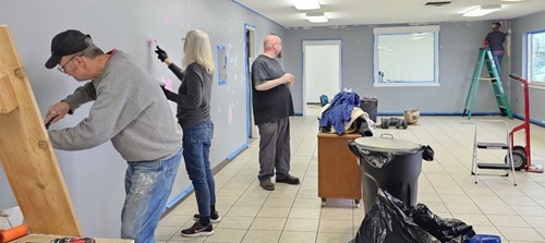 people painting a room